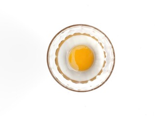 Egg yolk in bowl isolated on white background, Flat lay 
