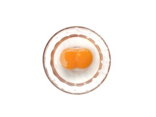Egg yolk in bowl isolated on white background, Flat lay 