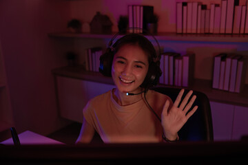 Friendly Gamer Waving During Live Stream Session
