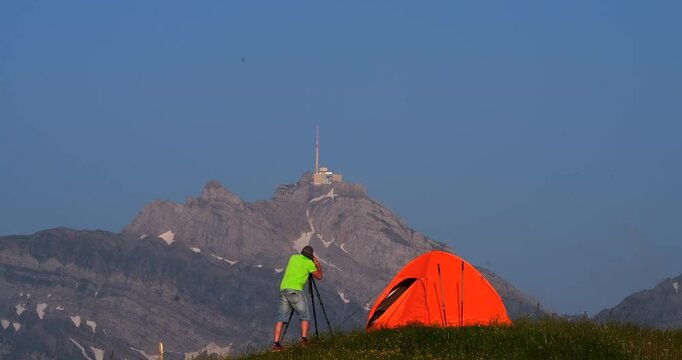 Camping in the mountains with a stunning view of the peak and sunset photography