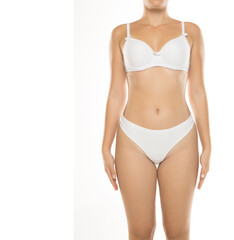 Studio shot of woman in white lingerie standing straight, front view, on white background.