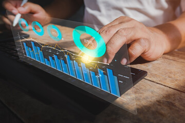 Business analysis. Businessman working on laptop computer analyzing finance sales data and economic growth graph chart and financial report, business and technology concept