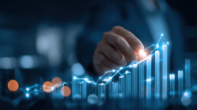 Businessman analyzing financial growth data with glowing graph