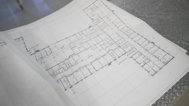 Floor plan sketch reveals room layout with sharp lines. Blueprint-style precision guides future structure. Project organization on display
