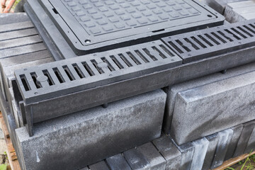 Plastic gutter of rain drain with grates and sewer hatches