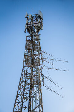 Phone tower against blue sky