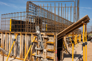 Rebar cage and formwork at a large construction site.