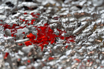 Red Paint Stain on Rough Silver Wall – Urban Macro Texture