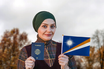 Muslim Woman Holding Passport and Flag of Marshall Islands
