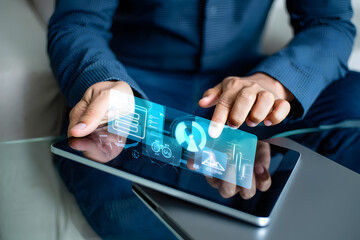 Businessman using digital tablet, futuristic interface, data analysis, charts, graphs, modern technology, professional, serious mood, blue tones.