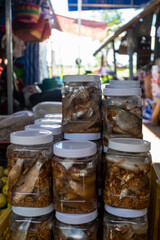 Fermented Fish in Jars at Traditional Southeast Asian Market