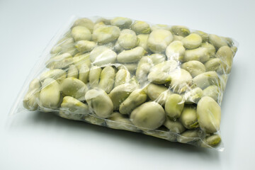 Broad beans in a plastic bag.

