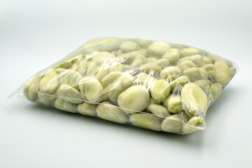 Broad beans in a plastic bag.
