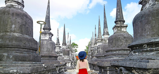 Visitor Walking Amongst the Rows of Minor Stupas of Wat Phra Mahathat Woramahawihan Buddhist...
