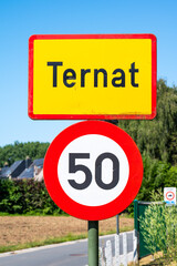 Traffic sign of Ternat, an urbanisation with a maximum speed limit of 50, Ternat, Flanders, Belgium