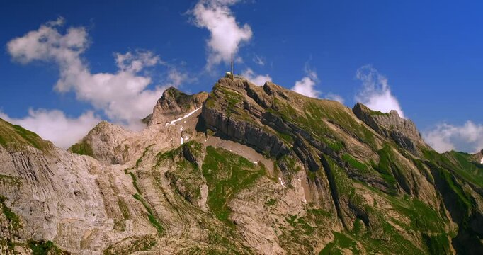 Stunning mountain landscape with dramatic sky and rocky peaks in broad daylight