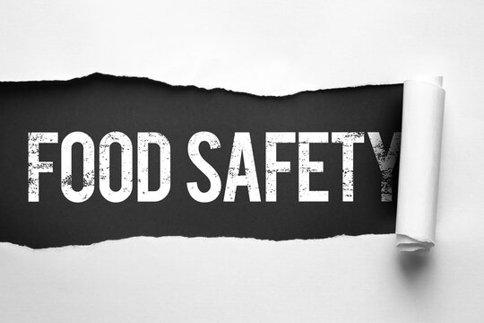 Word "Etiquette" in bold white letters revealed through torn paper. Black background contrasts with the ripped edges, emphasizing manners, behavior, and communication