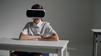 Student wearing virtual reality headset sitting at desk with crossed arms, exploring immersive educational technology in modern classroom learning environment - Powered by Adobe
