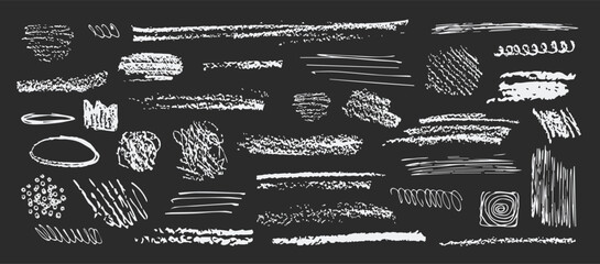 Variety of white chalk drawing patterns including lines scribbles circles and shapes on a gray background