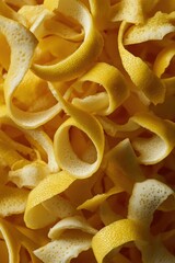 Fresh yellow lemon peels curling in a pile