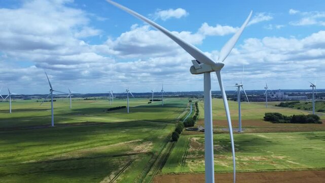 Aerial drone shot of power plant station generating electricity near Nottingham England UK cooling towers smoke stacks pylons sub station gas coal and oil power