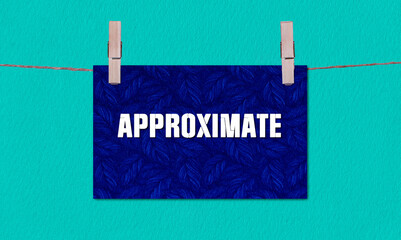 APPROXIMATE Symbol. Concept words APPROXIMATE on Dark Blue Rectangle Paper Hanging on a Wooden...