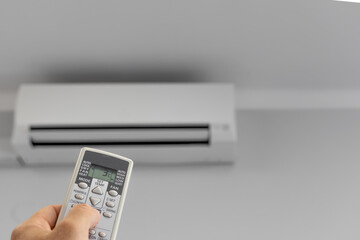 Air Conditioning Remote Control, Air Conditioner Hanging On White Wall Under Ceiling, Repair