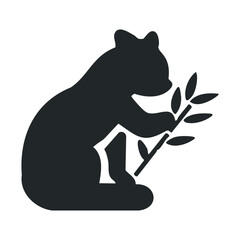 Silhouette of panda sitting and eating bamboo