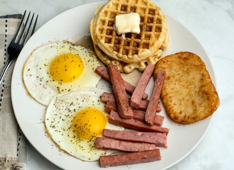 fried  eggs with waffles and spam  sticks