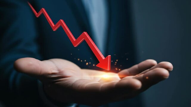 Red arrow pointing downward on a financial graph falling into a man's open hand. Business crisis and economic recession.