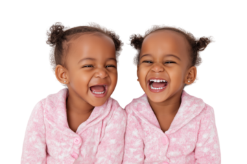 Two adorable twin girls share heartwarming laugh isolated on white background