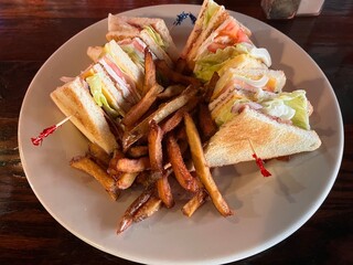 A Club Sandwich With French Fries