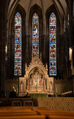 The image displays the interior of St Mary's Episcopal Cathedral in Edinburgh, Scotland.This photograph showcases,The High Altar: A prominent feature in the center, characterized by its intricate Goth