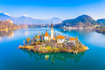 Aerial view of the fairytale island on Lake Bled, Slovenia, featuring the picturesque church...