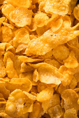 Full frame photo of crunchy golden cornflakes for breakfast