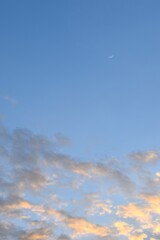 half moon floating on blue sky in twilight background 