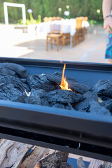 Outdoor barbecue grill with burning charcoal flames