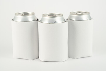Three Can cooler sleeves on isolated background. Neoprene can cooler blank.