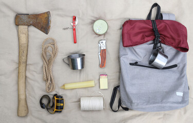 Hiking. Things and objects for tourism and survival in the forest or mountains. There is an axe,...