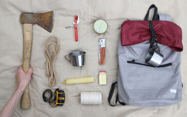 Hiking. Things and objects for tourism and survival in the forest or mountains. There is an axe,...