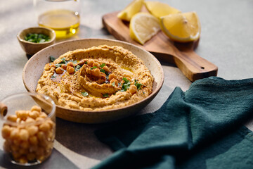 Delicious hummus with olive oil, chickpeas and parsley