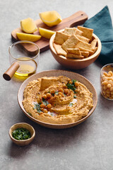 Delicious hummus with olive oil, chickpeas and parsley