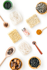 Chinese and Japanese food cooking with mushrooms, spices and noodles on white background top view geometric pattern