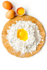 Making dough concept. Pile of flour and eggs on white background top view