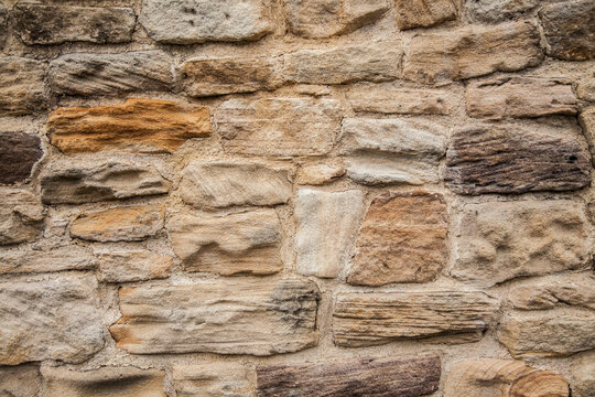 Rough brick textured stone wall