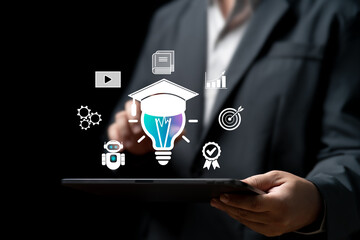 Business Idea with AI Technology concept, Businessman use the tablet and AI application for learning automation developing new things for the goal of success, AI E-learning education technology,Target