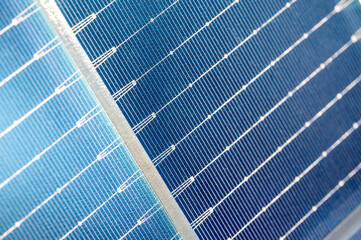 Macro view of a solar panel surface, showing fine details of photovoltaic cells. Renewable energy technology close-up.