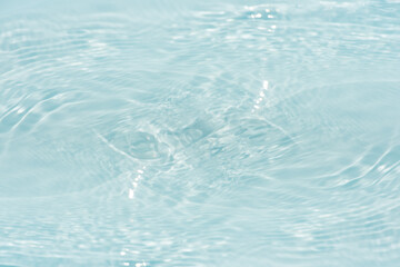 Blue water with ripples on the surface. Defocus blurred transparent blue colored clear calm water...