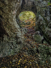 Inside view of the steep rocky passage leading down into the Sólyom-kút cave in Hungary’s Bükk...