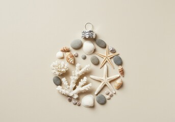 Christmas ornament made of seashells and starfish on beige background